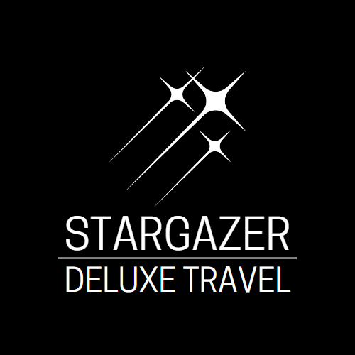This logo contains the words "Stargazer Deluxe Travel" in all caps and white font. Above the words are three white shooting stars pointing up toward the right.