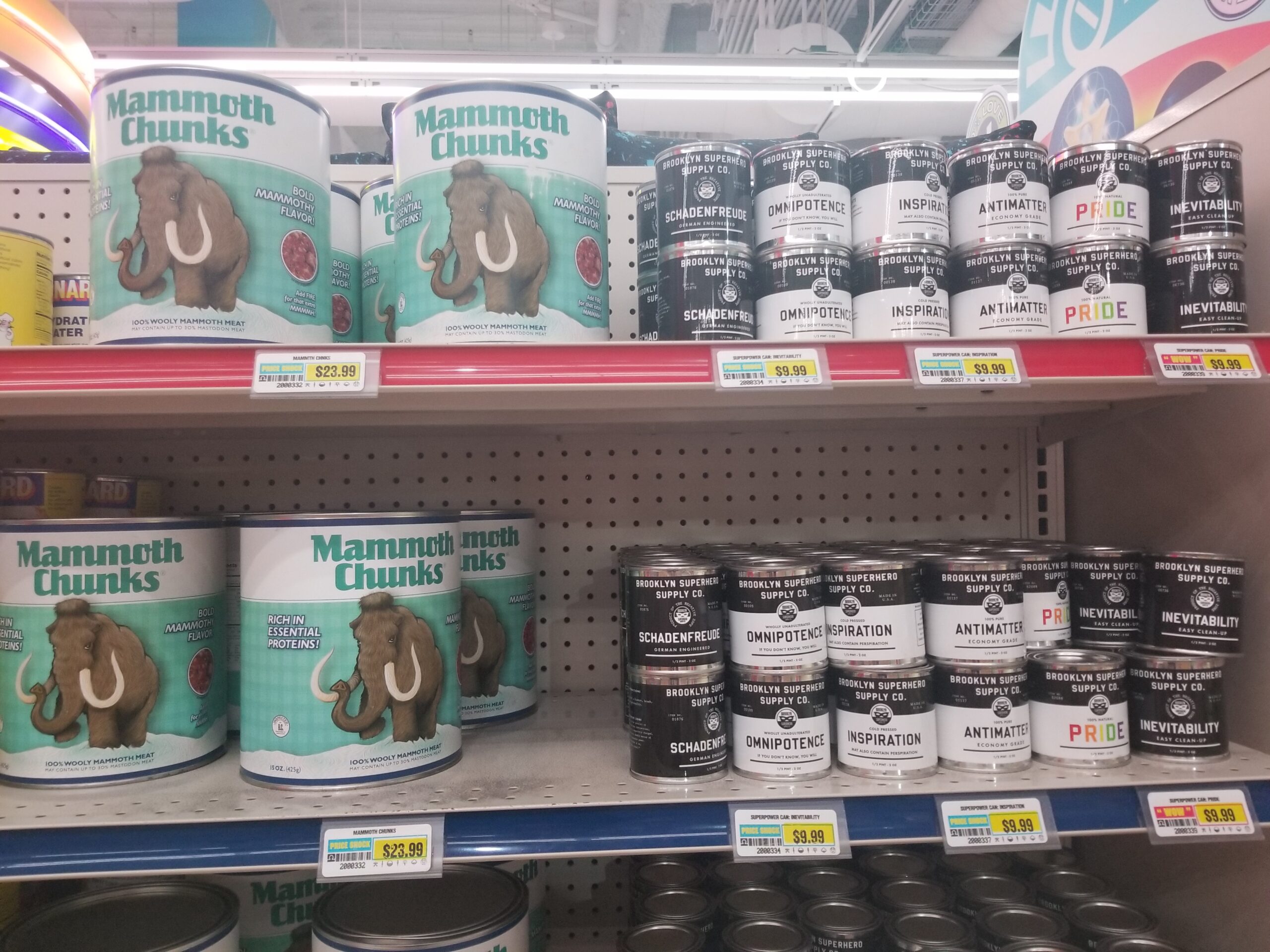 The image features products on a shelf in Omega Mart, an interactive art installation by Meow Wolf. One of the products is "canned mammoth."